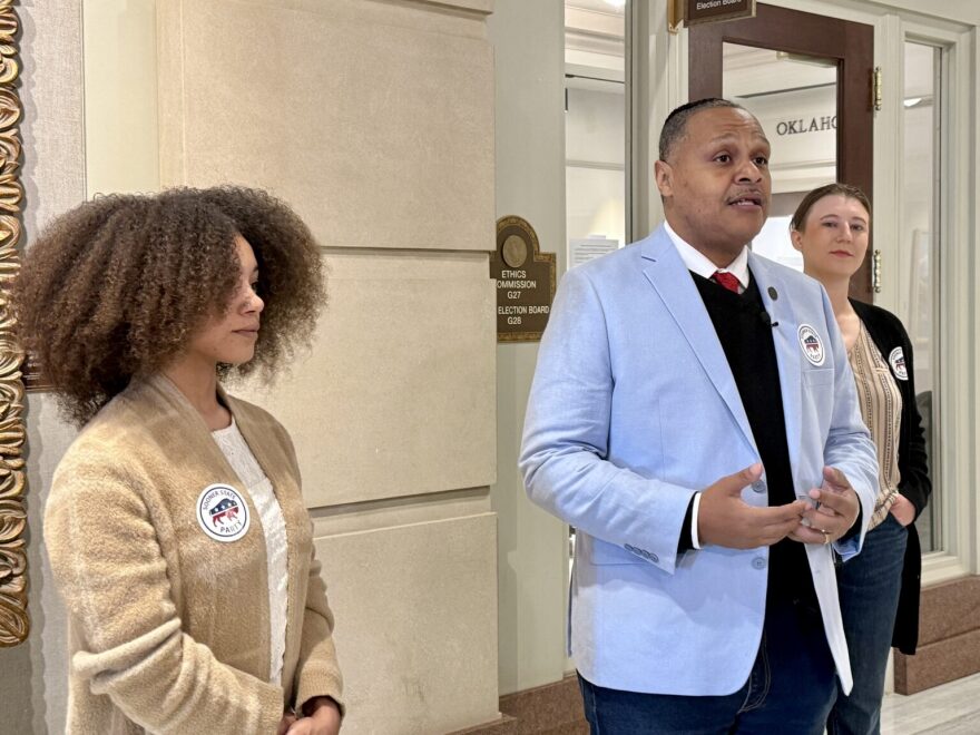 C.J. Webber-Neal, center, of Sooner State Party, speaks at a press conference in support of the state Election Board’s decision to keep voter data private. Cecilia Isac, left, and Regan Burns, right, stand with Webber-Neal outside the Election Board’s offices at the Capitol on Feb. 16, 2025.