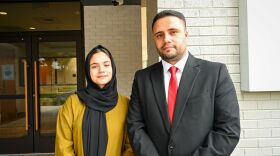 Tahira Askari and Bahroz Mohmand stand outside the Charlotte Center for Legal Advocacy.