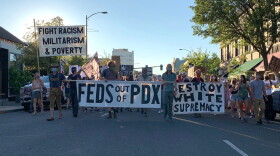 Protesters march down Main Street in Ashland in solidarity with Portland demonstrations. 