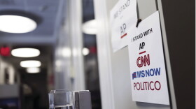 Signs of support for AP, CNN, MS NOW and POLITICO hang on the White House grounds on September 21, 2026 in Washington, DC.