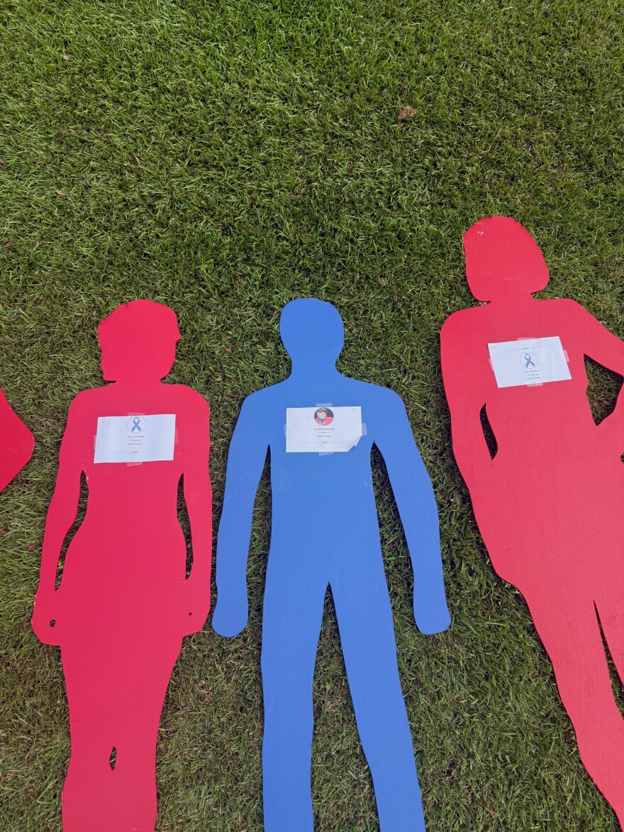 The silhouettes representing Rachel Jennings (left), Antoin Pugh (middle) and Rea'ven Graves (right) sit outside the State House. Pugh is survived by two daughters.