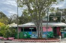 Outside photo of a pink and green building with a sign writing The Chattaway Established 1921 