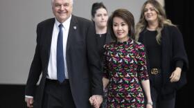 Nevada Gov. Steve Sisolak arrives with his wife, Kathy