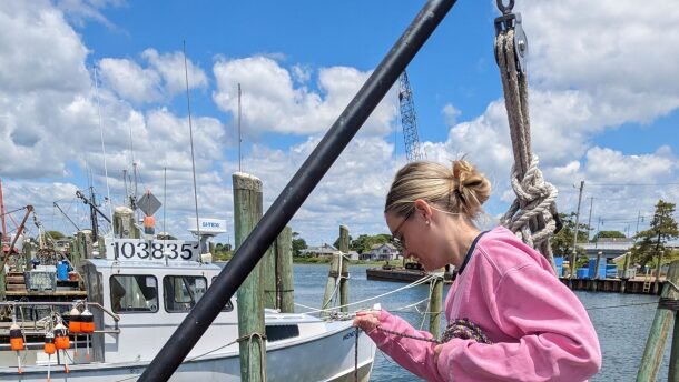 Caroline Williams collects a water column profile using a CTD instrument that records conductivity, temperature and depth.