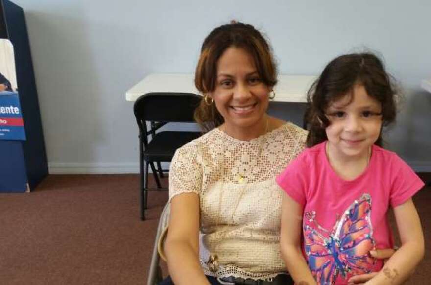 Zulenny Reveron and her daughter. Reveron is getting her paperwork together to file for the President's Deferred Action for Parents of Americans and Lawful Permanent Residents or DAPA program.