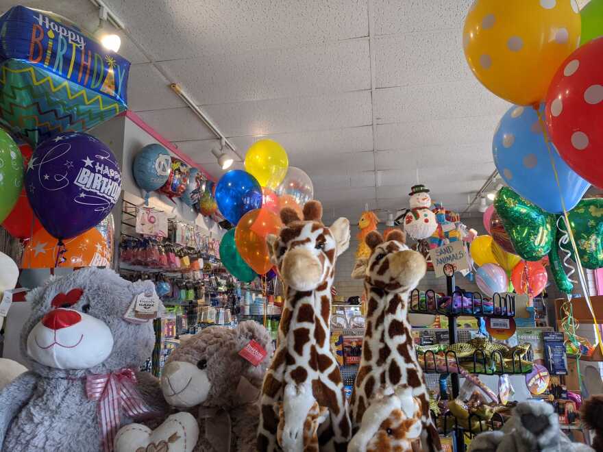 Shelves at Balloons and Tunes are lined with stuffed animals, party favors, paper napkins and gag gifts.