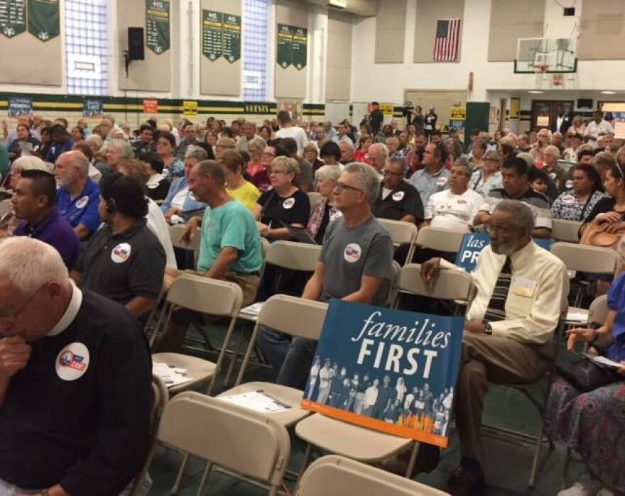 Faith leaders and community activists gathered Wednesday evening to rally against the federal budget soon up for consideration in Congress.