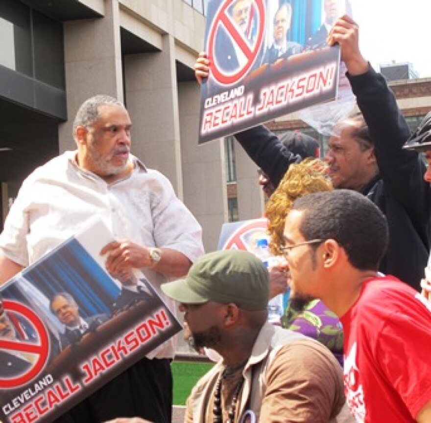 Norman Edwards, left, and other activists demonstrate in favor of recalling Cleveland Mayor Frank Jackson. (Brian Bull / ideastream)