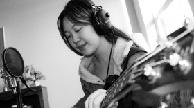 Pictoria Vark recording music on the guitar