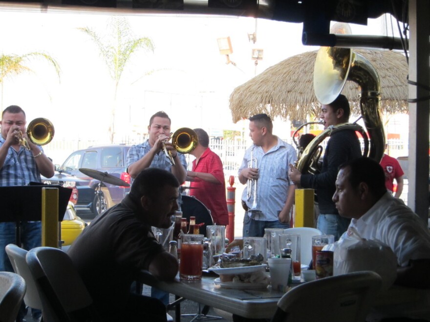 La Banda Rebelde charges twice as much per song as a band without a tuba charges. People have been known to throw hundred-dollar bills into the tubist's horn to show their appreciation.