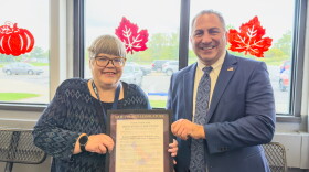 Stephanie Speaker, left, receives September's Erie County Citizen of the Month Award from Erie County Legislator Frank Todaro at the Depew Ice Pavilion on Tuesday, Sept. 29, 2026.