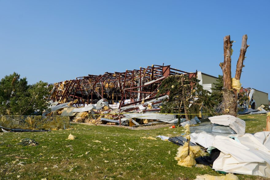Debris surrounded a damaged warehouse in the aftermath of a tornado that tore through Appleton, Wis., Tuesday, July 28, 2026. (AP Photo/Kayla Wolf)