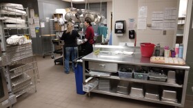 Foodservice staff work to prepare lunch for elementary and middle school students.