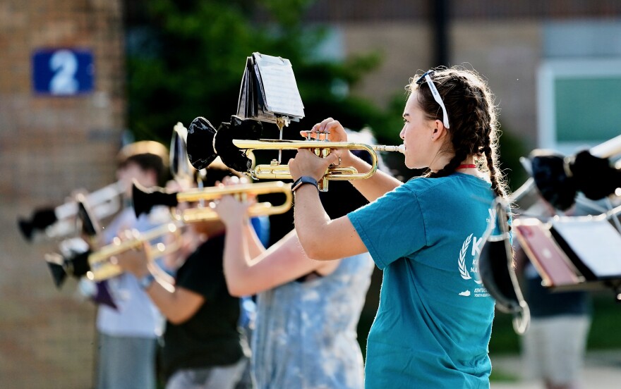 The Oldham County High School marching band brass section practices in-person along health and safety guidelines.