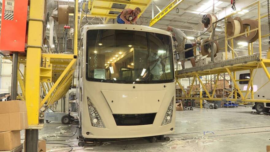 Workers assemble a new RV at Thor Motor Coach's Plant 750 in Elkhart.