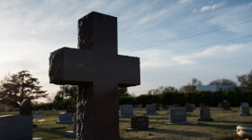 Headstones are shown in an Oklahoma City cemetery.