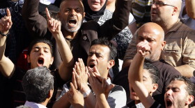 Syrians chant slogans outside the Othman Mosque in Damascus on May 12, 2012 during the funeral of victims of the twin bombings that happened in Damascus on May 10.