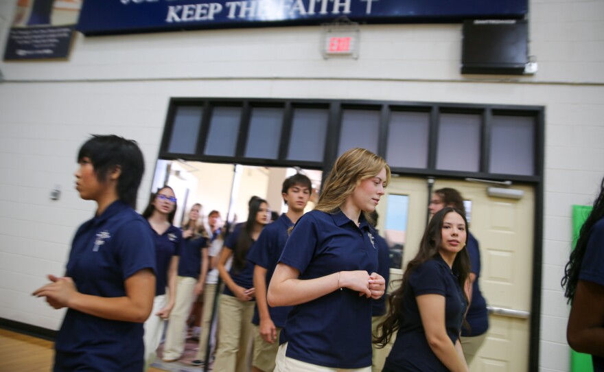 The sign atop the gym's entrance reads "Keep the faith."