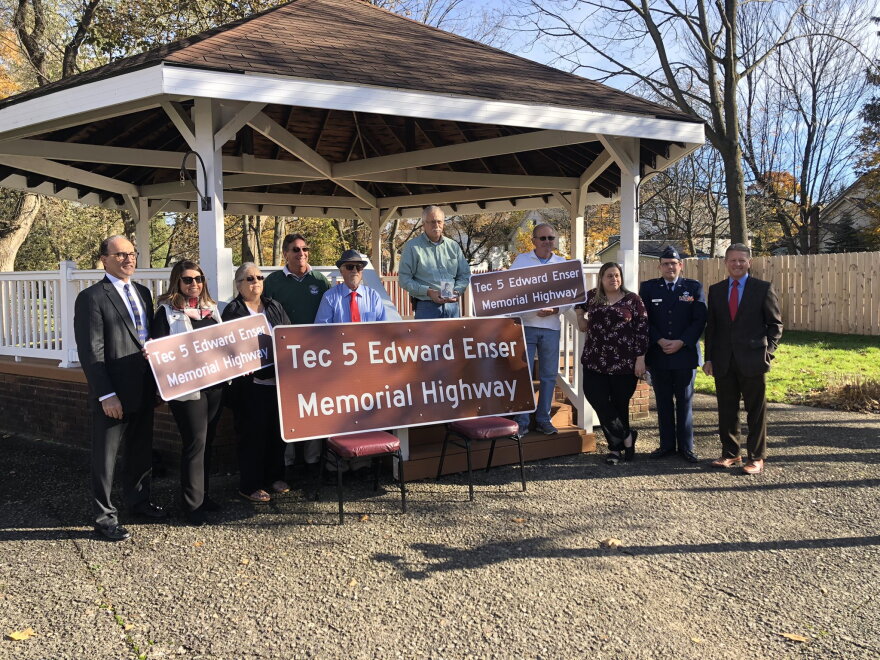 Sen. Patrick Gallivan and family of Tec. 5 Edward Enser gather to rename a portion of Route 75.