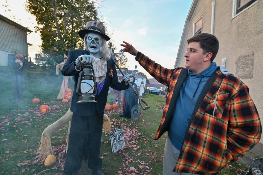 Will Kapmeyer, 15, points out modifications to a gravedigger he and a friend completed.