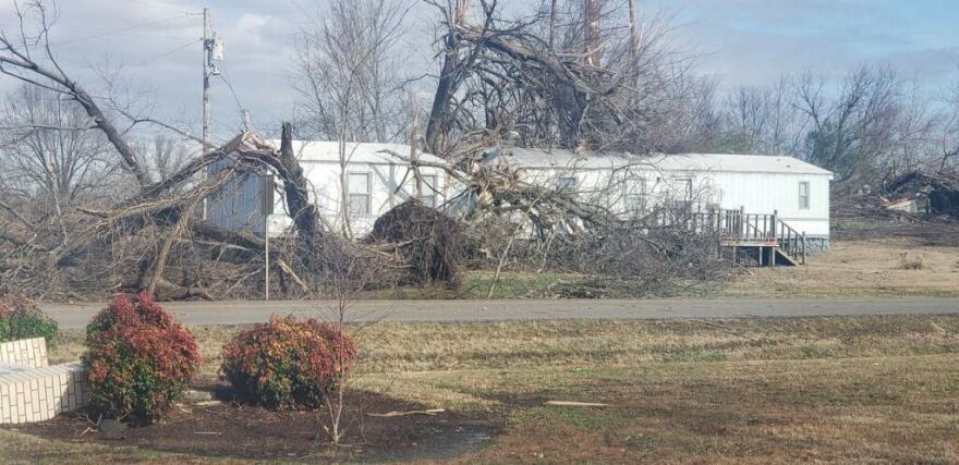 A photo of a house with a fallen tree ontop of it in Cayce Fulton, KY