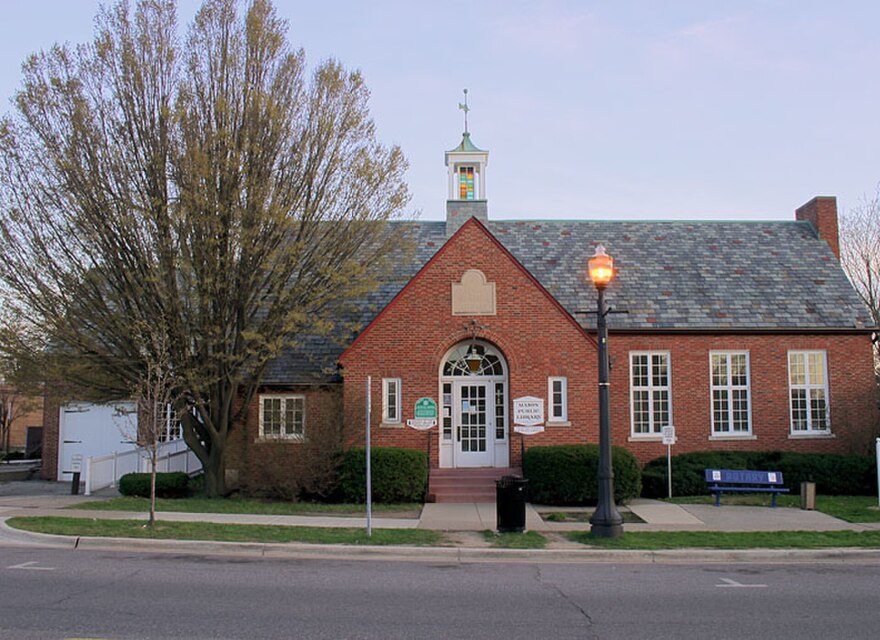The Mason Library, a medium-sized brick building on a streetside.