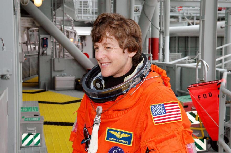 Following the mock countdown on Launch Pad 39B, STS-114 Mission Specialist Wendy Lawrence arrives at the slidewire basket area used for emergency egress from the Fixed Service Structure at the pad. This is part of the pre-launch training included in Terminal Countdown Demonstration Test (TCDT) activities.