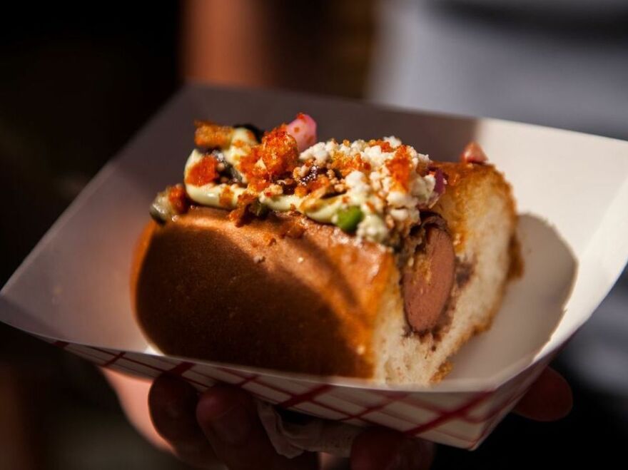 A hot dog, wrapped in another kind of meat, gets wrapped in another kind of meat when you put it in your mouth.