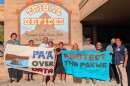 Members of the Pyramid Lake Paiute Tribe and the Water Over Data Alliance stand in front of the Tribal Offices in Nixon, Nevada on August 21.