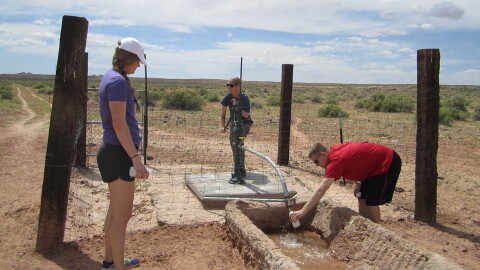 Ingram's students investigate a water source on the Navajo Nation.