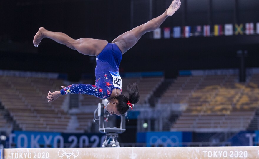 Simone Biles competes at the balance beam during qualification at the Olympic Games on Sunday in Tokyo.