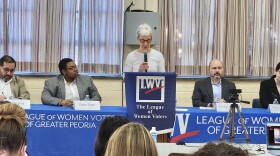 Moderator Roberta Parks from the League of Women Voters of Greater Peoria speaks during a Peoria Public Schools school board candidate forum Saturday. The candidates are (from left) Andy Diaz, David Daye, Doug Shannon and Sarah Howard.