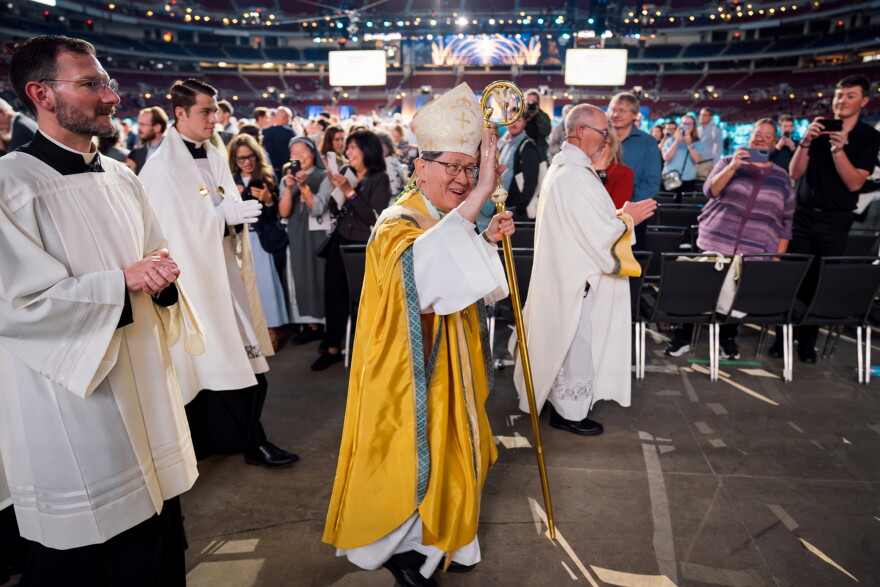 Cardinal Luis Antonio Tagle waves to the crowd at the conclusion of the beatification Mass for the late Archbishop Fulton J. Sheen on Thursday at the Dome at America's Center in downtown St. Louis.
