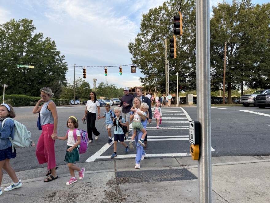 Students and parents walk into Beverly Woods Elementary School on the first day of the 2026-27 school year.