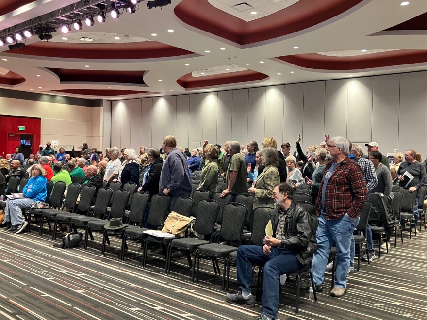 The crowd at the April 6 Iowa Utilities Commission meeting at Rhythm City, Davenport, with those opposed asked to stand and raise their hands.