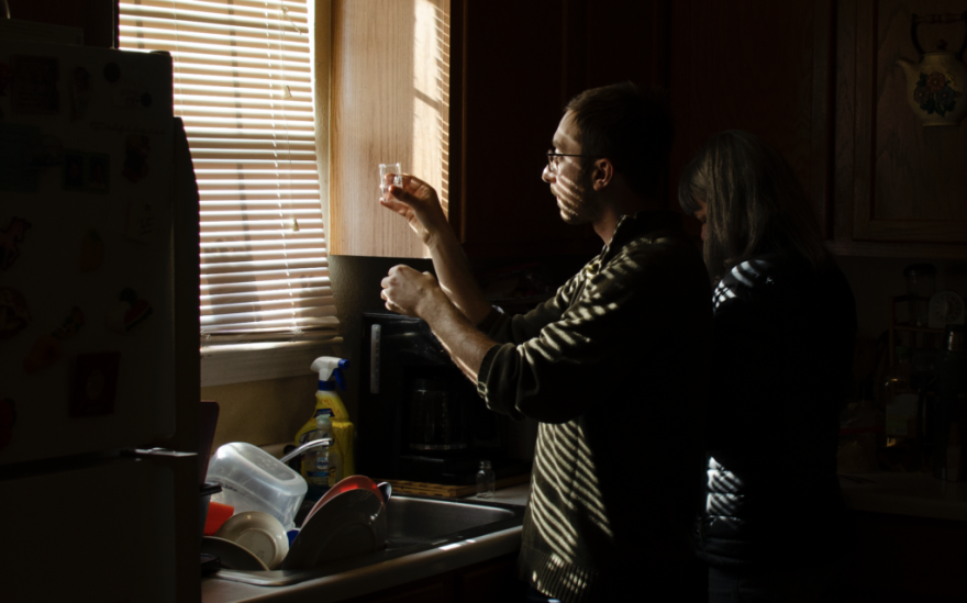 Matthew Frankel of the Environmental Law Clinic at the University of Texas Law School conducts water testing at houses in Toyah in February 2023.