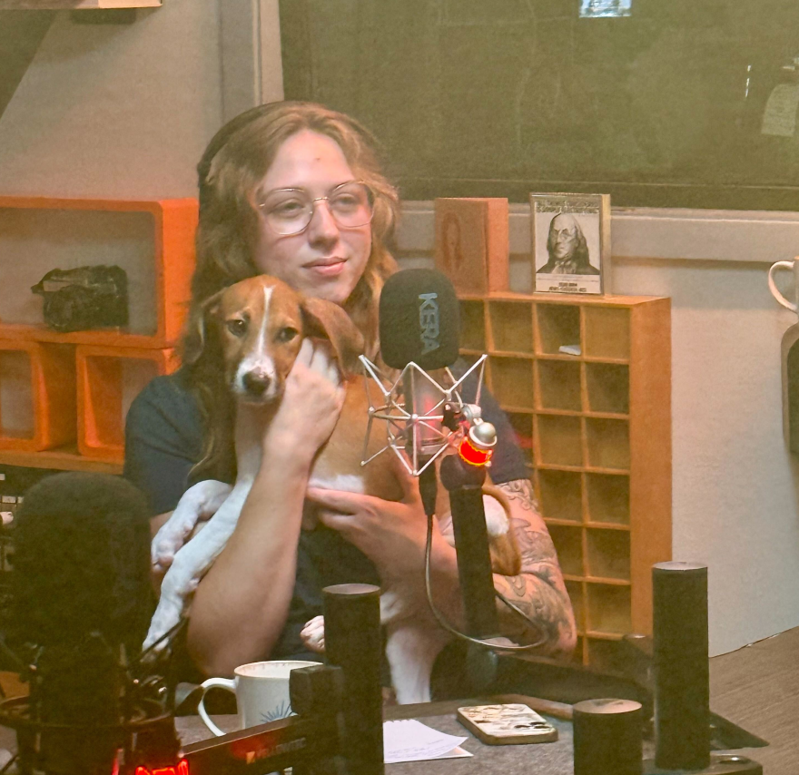 NTX Now's managing producer Bekah Morr holds two-month-old Rocky in studio during the interview.