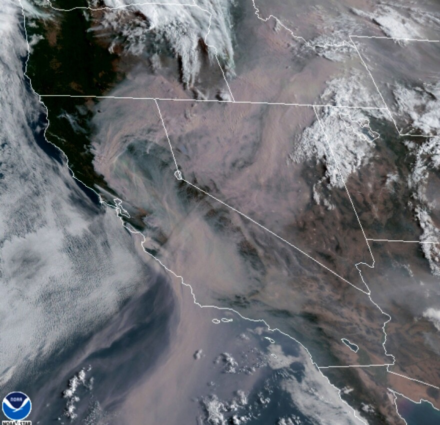 This satellite image from the Cooperative Institute for Research in the Atmosphere (CIRA) and released by the National Oceanic and Atmospheric Administration (NOAA) shows smoke from massive wildfires in Northern California, top left, being pushed by winds to the northeast on Thursday, Aug. 20, 2020.