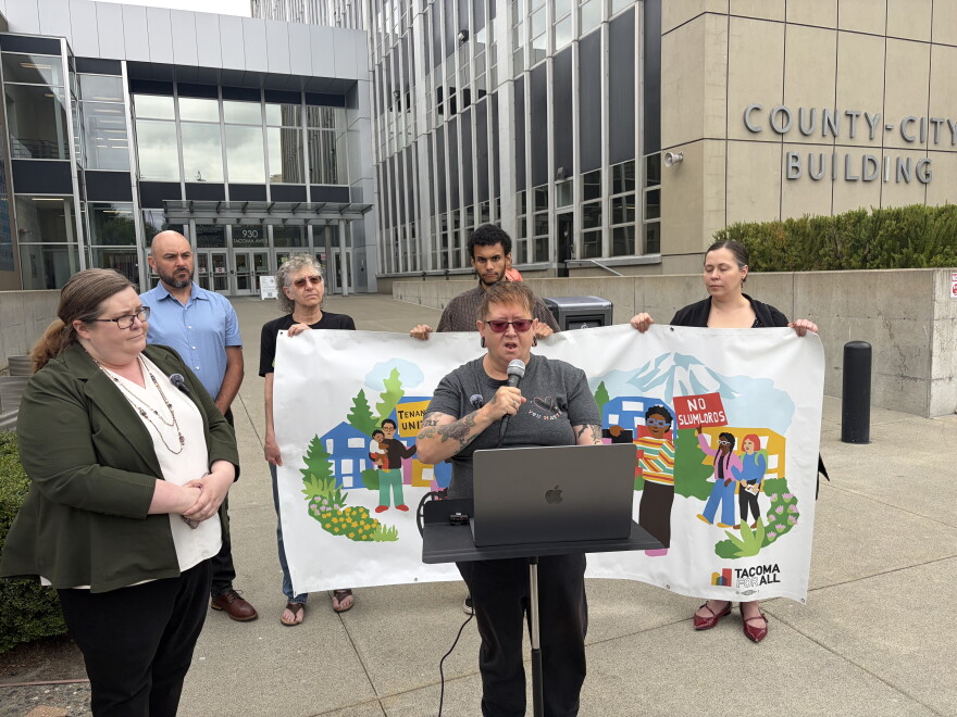 Westside Estates resident Melody Frazier speaks at a news conference outside the Pierce County District Court alongside her attorney, Ann Dorn, on Tuesday, Sept. 1.