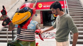 Daniyal Shahbaz, a native of Pakistan, stands next to the Iowa State University mascot inside the school’s Memorial Union building during fall freshman orientation in 2024.