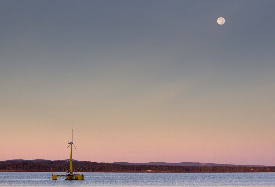 In this Friday, Sept. 20, 2013 photo, the University of Maine's 9,000-pound prototype wind turbine generates power off the coast of Castine, Maine. It is the country's first floating wind turbine.