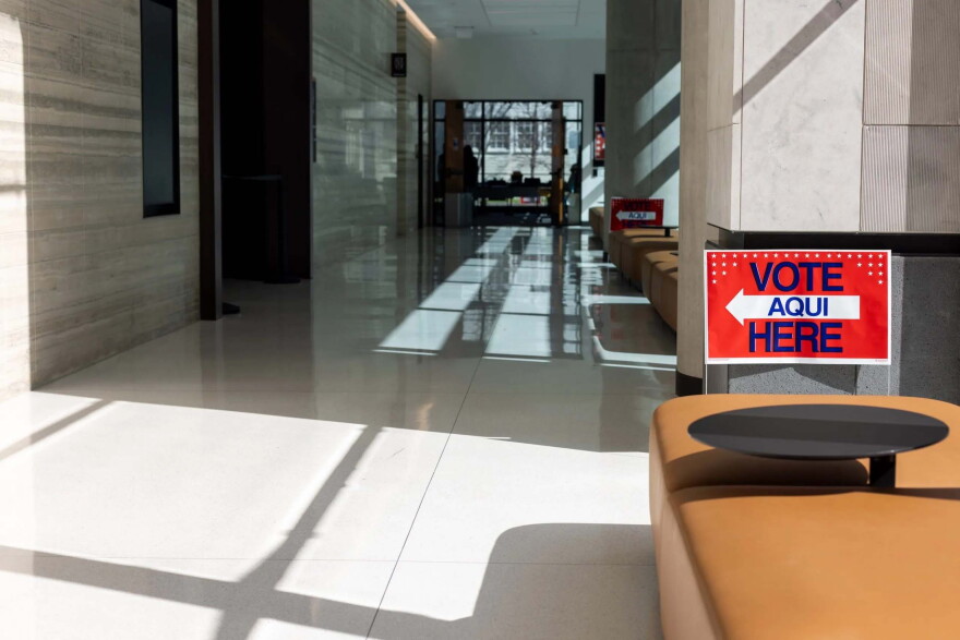 A sign points voters to a polling place inside the Travis County Civil and Family Courts Facility on March 1, 2024.