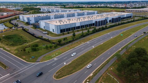 Cars drive past data centers on July 16, 2023, in Ashburn, Va.