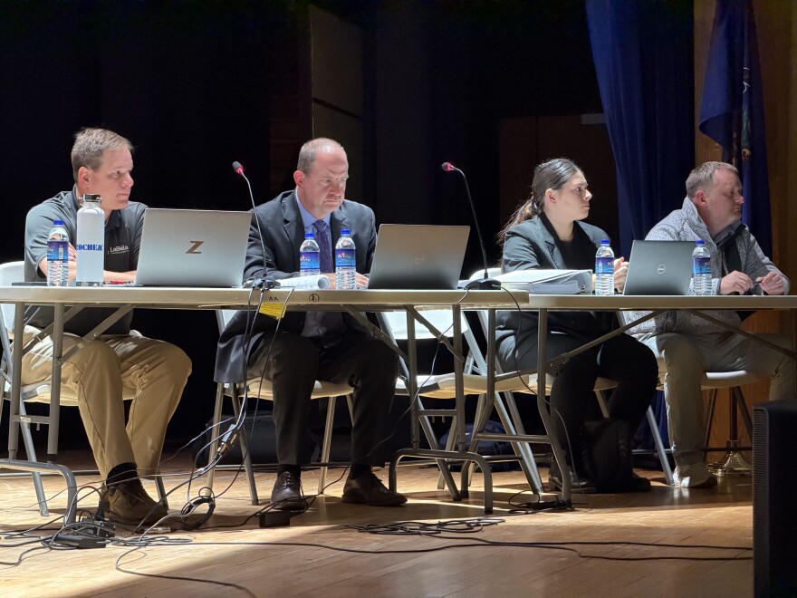 Albert J. Magnotta III, left, from LaBella Associates, and attorney Edmund Campbell, a lawyer representing Cornell Realty Management LLC, and other expert witnesses, sit on the Valley View High School stage during a conditional use hearing for Cornell's proposed data center campus in Archbald.