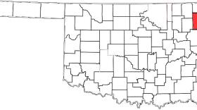 Delaware County, colored red, is east of Tulsa.