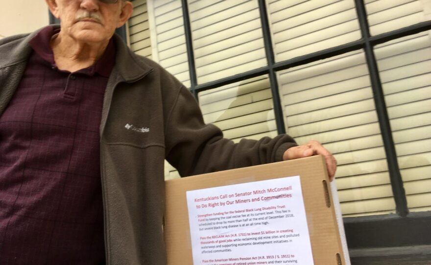 Disabled retired miner Carl Shoupe prepares to deliver a message to Sen. McConnell.