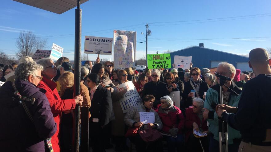 An overflow crowd forced Rep. Tom Reed to hold a town hall in Ashville, N.Y., outside in a parking lot.