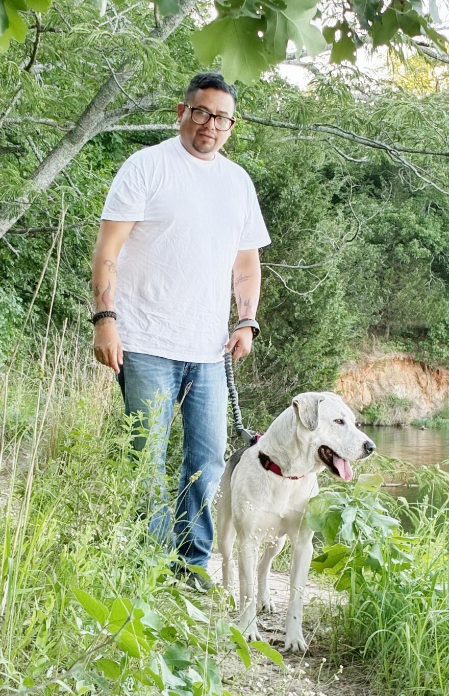 Chico and his new owner Richard Vasquez on one of their many daily walks. Vasquez was released from prison in April and adopted Chico after working with him as part of the Enduring Service program. They now live in Denison.