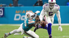 Tyrod Taylor of the Buffalo Bills avoids the tackle from Andre Branch of the Miami Dolphins during the second quarter at Hard Rock Stadium on Dec. 31, 2017 in Miami Gardens, Fla. (Mike Ehrmann/Getty Images)
