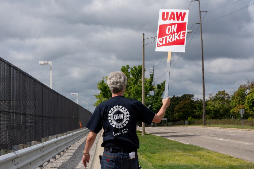 UAW member strikes outside of the Lansing Grand River GM Plant on Monday, September 16, 2019